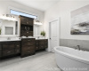 Full bathroom featuring double vanity and a freestanding tub