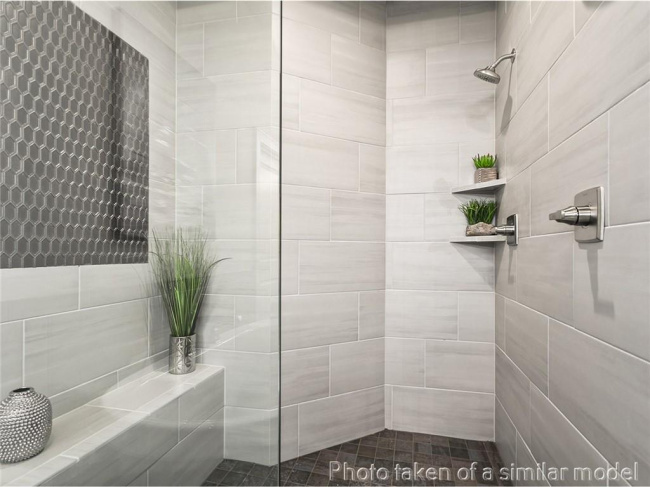 Full bathroom with tiled shower