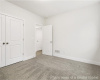 Unfurnished bedroom featuring carpet flooring and a closet
