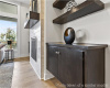 Detailed view of a tiled fireplace and wood finished floors
